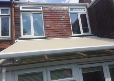 Awning installed above conservatory