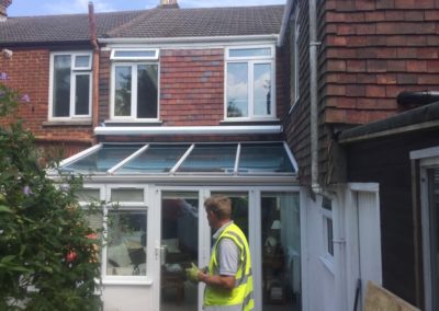 Awning installed above conservatory - white cassette