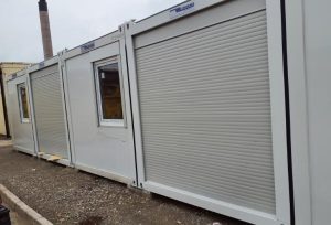 Shipping container roller shutters