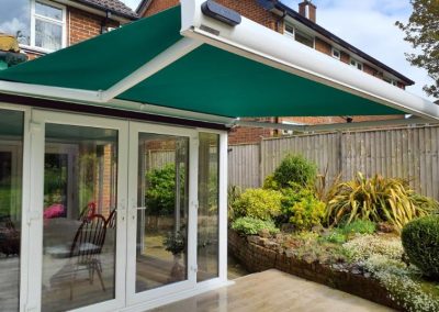 White Cassette Awning with Moss Green Fabric